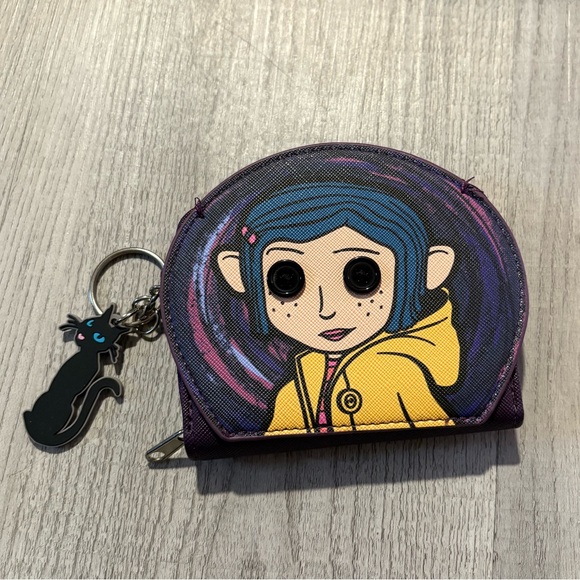 Spencer's Handbags - Coraline - Spencer's Purple and Yellow Character Wallet